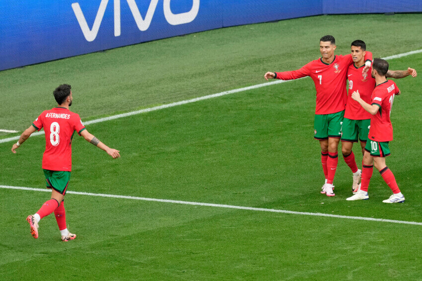 Portugal players celebrate a goal EURO 2024